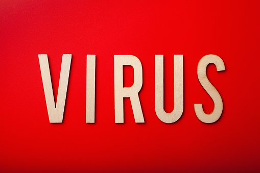 virus word text wooden letter on red background corona virus covid-19